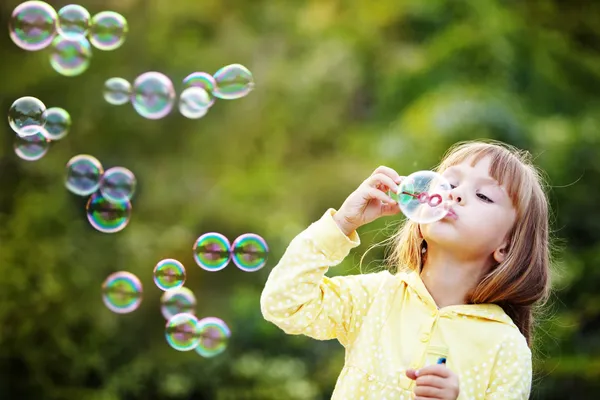 Girl_Blowing_Bubbles_2 Little girl blowing bubbles